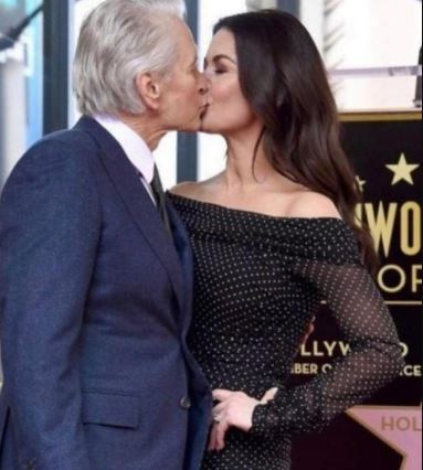Diandra Luker's ex-husband Michael Douglas kissing his current wife Catherine Zeta-Jones